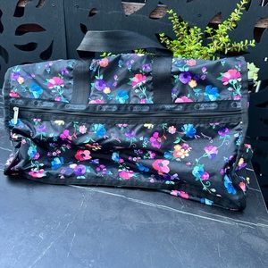 LeSportSac black with floral pattern tote.